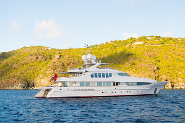 Yachting and sailing adventure in gustavia, st.barts. Yacht at sea coast on sunny blue sky. Luxury...