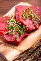 Fresh raw beef tenderloin and marbled steaks with seasoning