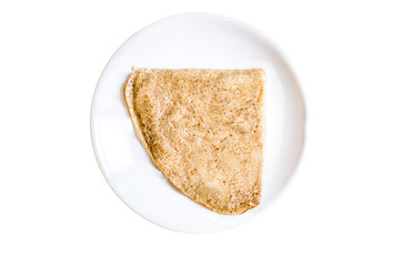 Fototapeta na wymiar Folded pancake on a plate. Isolated