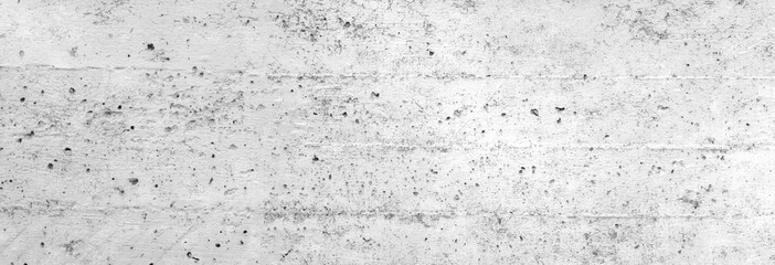 Textur einer weißen Betonwand als Hintergrund, auf der man die Abdrücke der Schalungsbretter noch sieht, was man als Linien nutzen kann