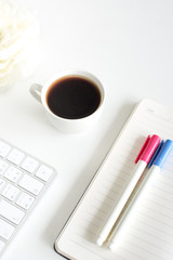 A cap of coffe and notebook