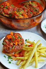 Veal with yellow beans on white plate