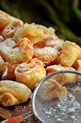 Crunchy sweets with powdered sugar