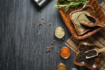 Big set of Indian spices and herbs . Black stone background