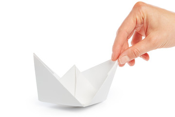 Naklejka premium Paper ship in a female hand