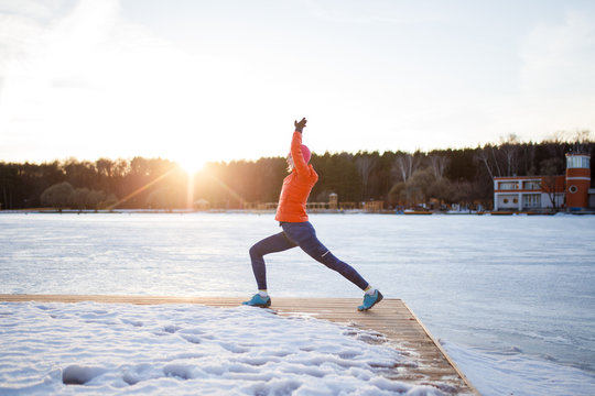 Photo of sports woman on morning exercise in winter