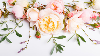 Festive flower composition on the white wooden background. Overhead view