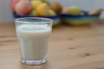 oatmeal drink in a glass in front of breakfast fruit