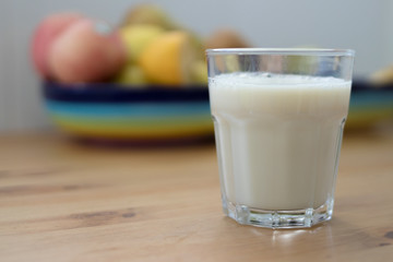 oatmeal drink in a glass in front of breakfast fruit