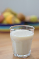 oatmeal drink in a glass in front of breakfast fruit