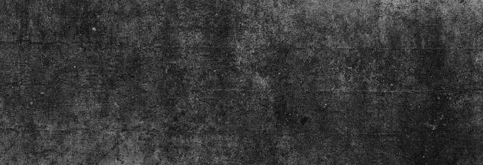 Textur einer fast schwarzen, strukturierten Betonwand, als Hintergrund