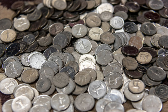 A pile of Dirham coins horizontal