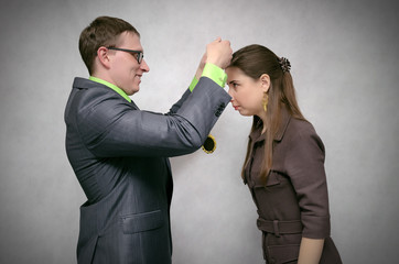 Rewarding a person with a gold medal for first place and victory at competitions or business...