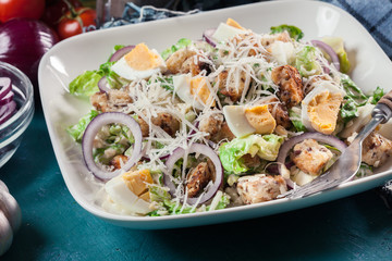 Healthy caesar salad with cheese, eggs and croutons