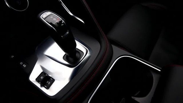 Top view rail video of shift knob of automatic gearbox in car interior 

