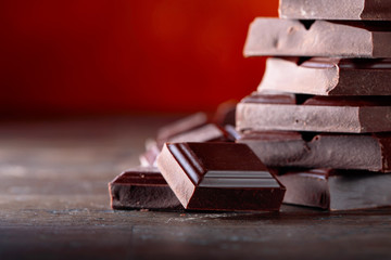 Broken black chocolate pieces.