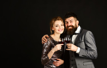 Man with beard and woman in shining dress celebrate