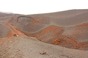The Etna volcano. The Etna volcano crater. Black Volcanic Earth, Volcanic Lava and Stones.  Dense...