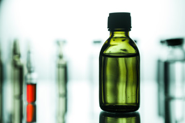 Group of ampoules with a transparent medicine in medical laboratory