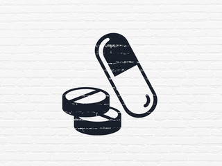 Medicine concept: Painted black Pills icon on White Brick wall background