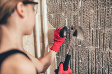 Daughter helping to remove old wall tails