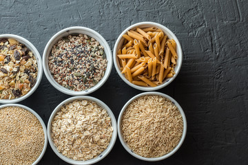 Bowls with whole grain carbohydrates, oats, brown rice, seeds, quinoa and whole grain pasta. Whole grain cereals