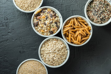 Bowls with whole grain carbohydrates, oats, brown rice, seeds, quinoa and whole grain pasta. Whole grain cereals