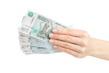 Hand with Russian rubles, isolated on white