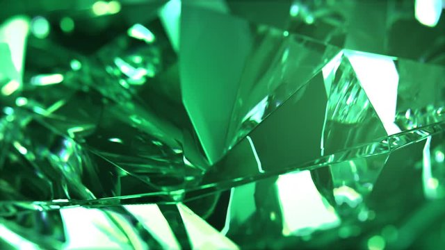 Close-up of slowly rotating green diamond. Seamless loop, nice looping background