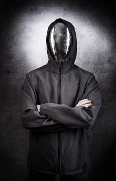 Faceless character with the mirror mask on grey background.