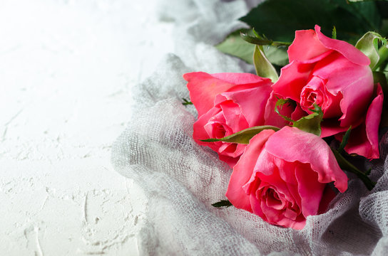 Pink roses bouquet over white background. Top view with copy space.