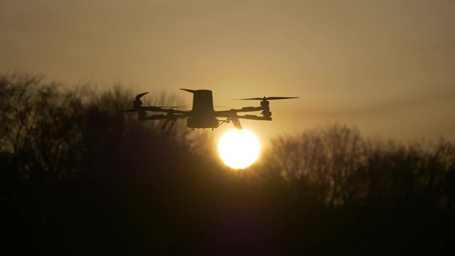 Drone on a background of the solar disk