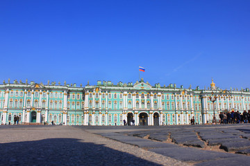 Palace Square Old Historical Architecture with Winter Palace Building on Sunny Summer Day in Saint Petersburg, Russia. Famous City Landmark Wallpaper on Empty Blue Sky Background, Low Angle View.