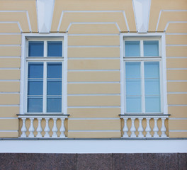 Windows on Building Wall of Classical Bright House. Architecture Detail of Historic Yellow and White Colored House Facade Exterior with Simple Windows in Saint Petersburg, Russia.