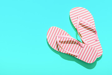 Pink Beach flip flop on turquoise background