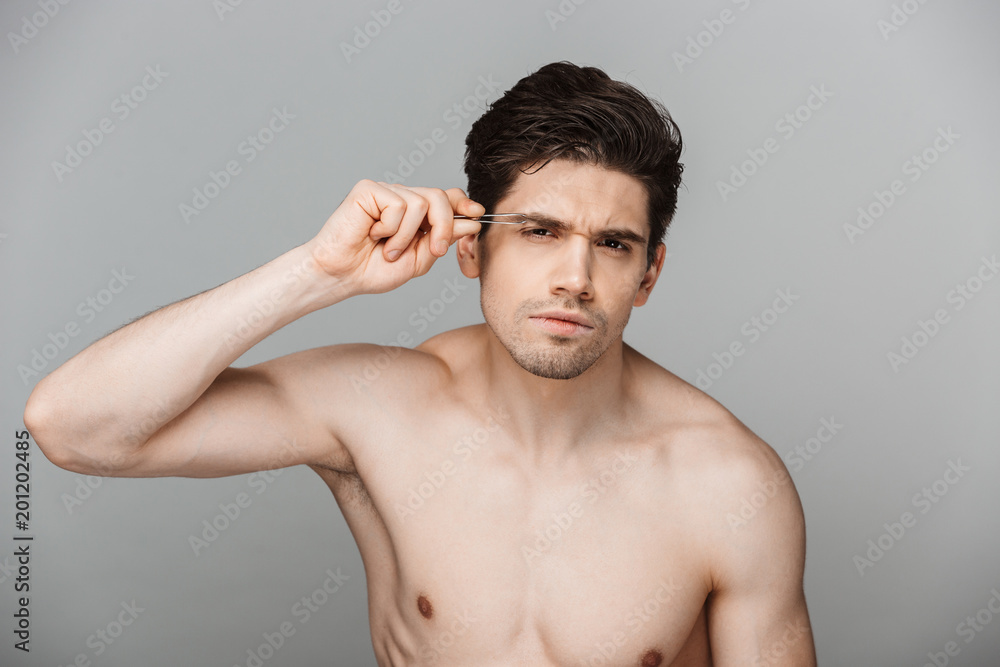 Wall mural Beauty portrait of half naked focused young man