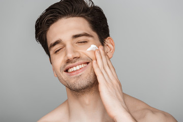 Close up beauty portrait of half naked satisfied young man