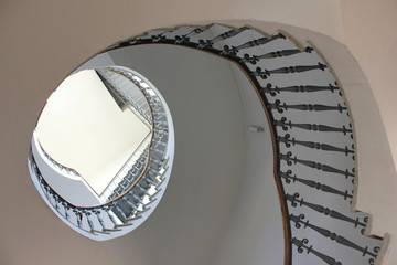 Spiral Stairs of Old Historic Building. Perspective View of Vintage Circular Staircase Leading Up...