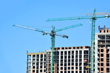 Crane and highrise construction site