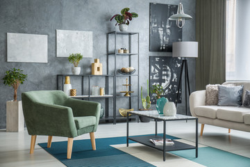 Green armchair next to table