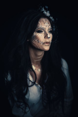 Girl with a stylized make-up of a dead bride