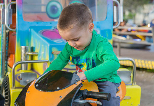 little boy in amusement park 