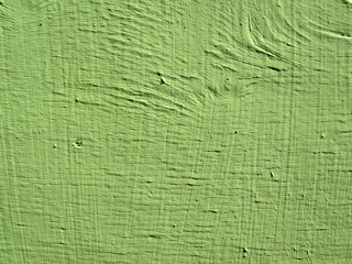 Green painted wooden surface texture. Rough wall background