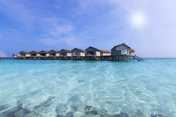 Maldivian wooden bungalows over sea