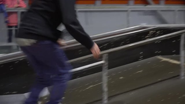 Montage as a man skates from the ramp and makes a grind on the railing