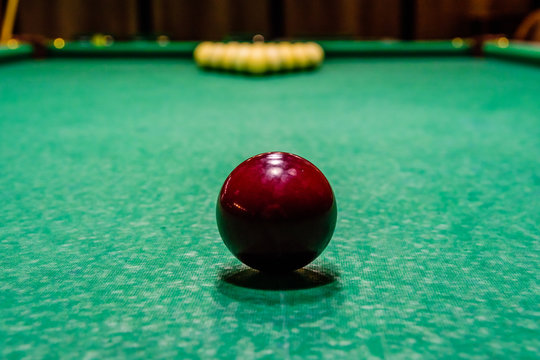 Red ball on the green cloth. Russian billiard