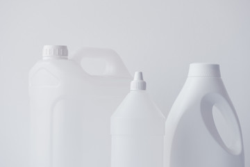 White plastic jerrycan and bottle canister for chemical liquids