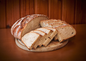 Sliced rye bread on wooden table. Selective focus.