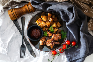 roasted sleeves chicken with potatoes and barbecue sauce