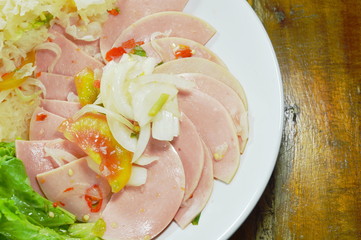spicy pork bologna and white mushroom salad on plate